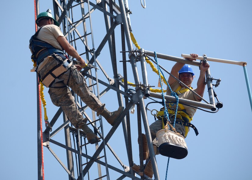 Communications Flight Radio Frequency Technicians Tech. Sgts. Josh Petersen and Michael Hedrick update antennas on a communication tower located at Antoine Butte near Zortman, Mont., Aug. 14, 2015. The Montana Air National Guard personnel were updating antennas for the United States Bureau of Land Management. (U.S. Air National Guard photo/Senior Master Sgt. Eric Peterson)
