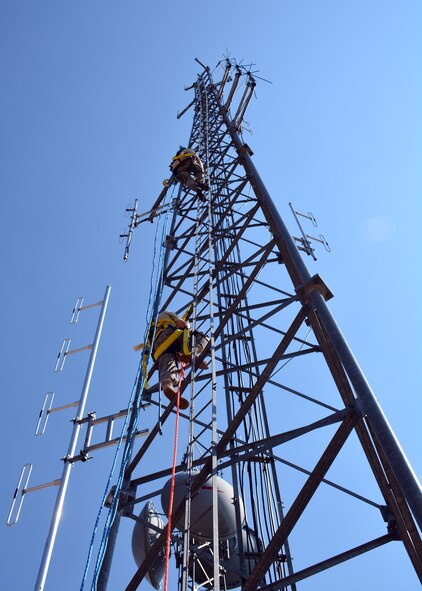 120th Communications Flight Radio Frequency Technicians Tech. Sgts. Josh Petersen and Michael Hedrick climb a communication tower located at Antoine Butte near Zortman, Mont., Aug. 14, 2015. The Montana Air National Guard personnel were updating antennas for the United States Bureau of Land Management. (U.S. Air National Guard photo/Senior Master Sgt. Eric Peterson)