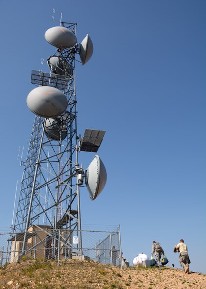 120th Communications Flight members carry equipment to the communications towers located at Antoine Butte near Zortman, Mont., Aug. 14, 2015. The Montana Air National Guard personnel were updating antennas for the United States Bureau of Land Management. (U.S. Air National Guard photo/Senior Master Sgt. Eric Peterson)