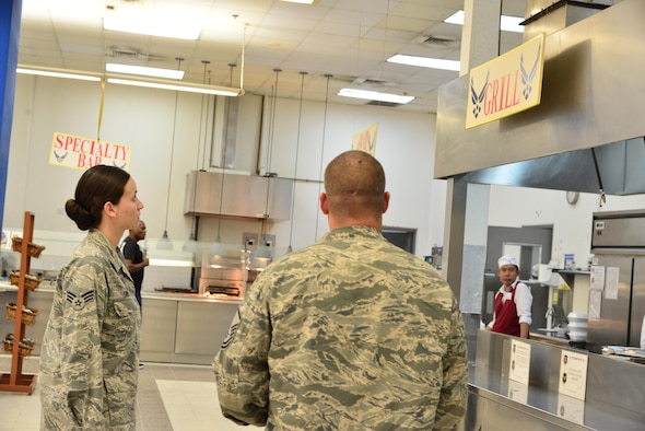 Senior Airman Leah Smith, 379th Expeditionary Medical Operations Support Squadron Bioenvironmental, surveys a dining facility ventilation system that will be tested for its flow rate with Master Sgt. Christopher Lance, 379th Expeditionary Civil Engineer Squadron Fire Department, September 30, 2015 at Al Udeid Air Base, Qatar. (U.S. Air Force photo/Staff Sgt. Alexandre Montes)