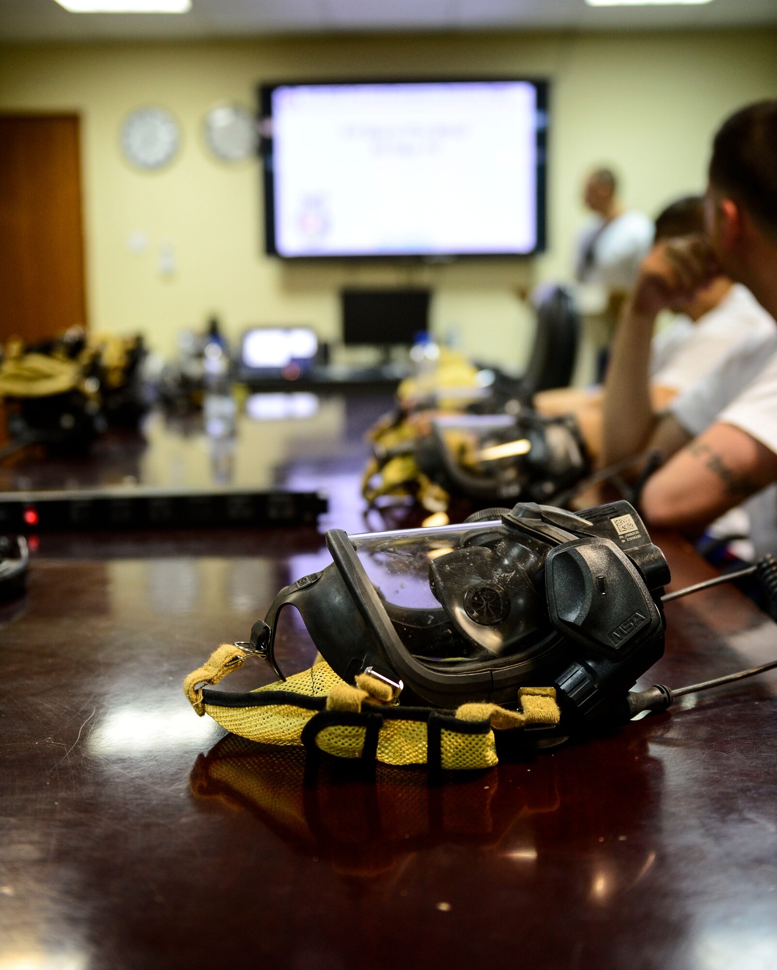 Firefighters of the 386th Civil Engineer Squadron receive a safety brief at an undisclosed location in Southwest Asia, Sept. 30, 2015. Prior to a controlled burn, firefighters discussed the simulated scenario, a candle catching fire on furniture, as part of Fire Prevention Week. (U.S. Air Force photo by Senior Airman Racheal E. Watson/Released)