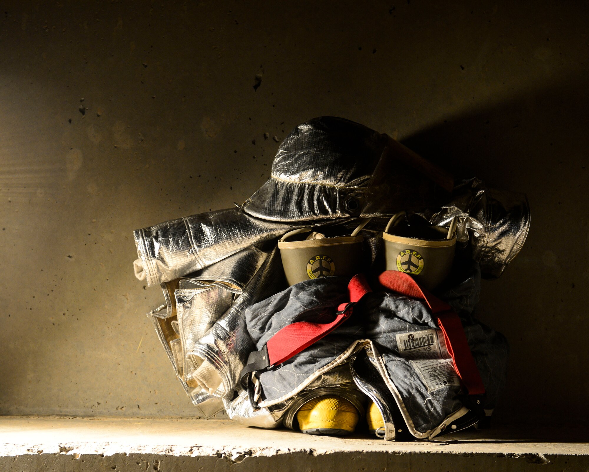 Firefighters of the 386th Civil Engineer Squadron fire department have gear standing by in preparation for Fire Prevention Week at an undisclosed location in Southwest Asia, Sept. 30, 2015. Every dorm and tent should have a smoke detector installed, testing the device once a month and changing the batteries every six months. (U.S. Air Force photo by Senior Airman Racheal E. Watson/Released)