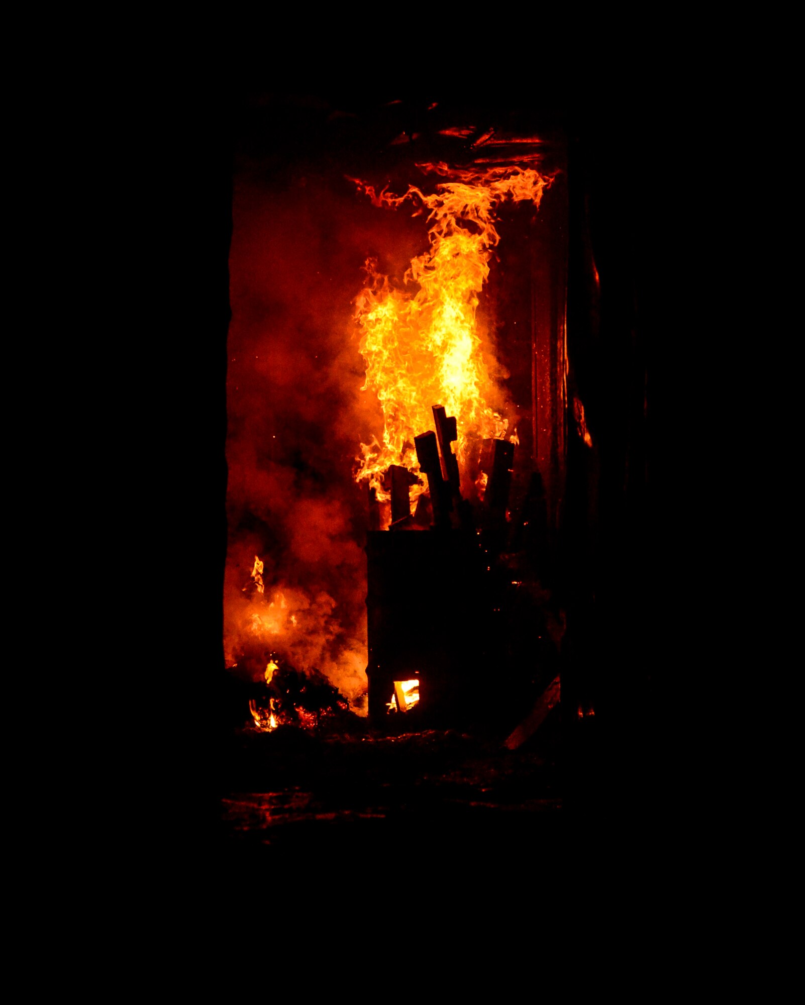 Members of the 386th Civil Engineer Squadron fire department conducted a controlled burn in preparation for Fire Prevention Week at an undisclosed location in Southwest Asia, Sept. 30, 2015. Roughly three out of five fire deaths happen in homes with no smoke alarms or the smoke alarm is not maintained properly. (U.S. Air Force photo by Senior Airman Racheal E. Watson/Released)