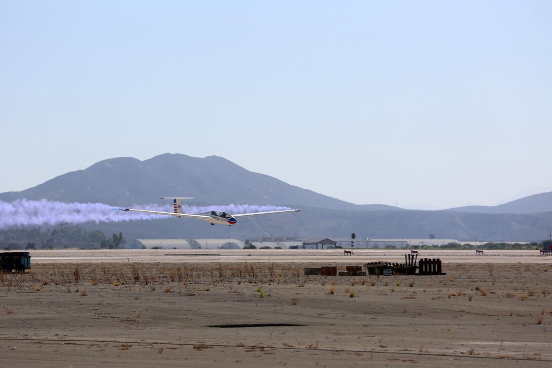 Bret Willat, a pilot with the Sailplane Magic Air Show team, flies a Grob G-103 Acro Twin II just above the ground during an aerial performance at the 2015 MCAS Miramar Air Show at Marine Corps Air Station Miramar, California Oct. 3. The Willat family owns and operates Sky Sailing Inc., one of the largest glider ports and training facilities in the world. (U.S. Marine Corps photo by Sgt. Melissa Wenger/Released)