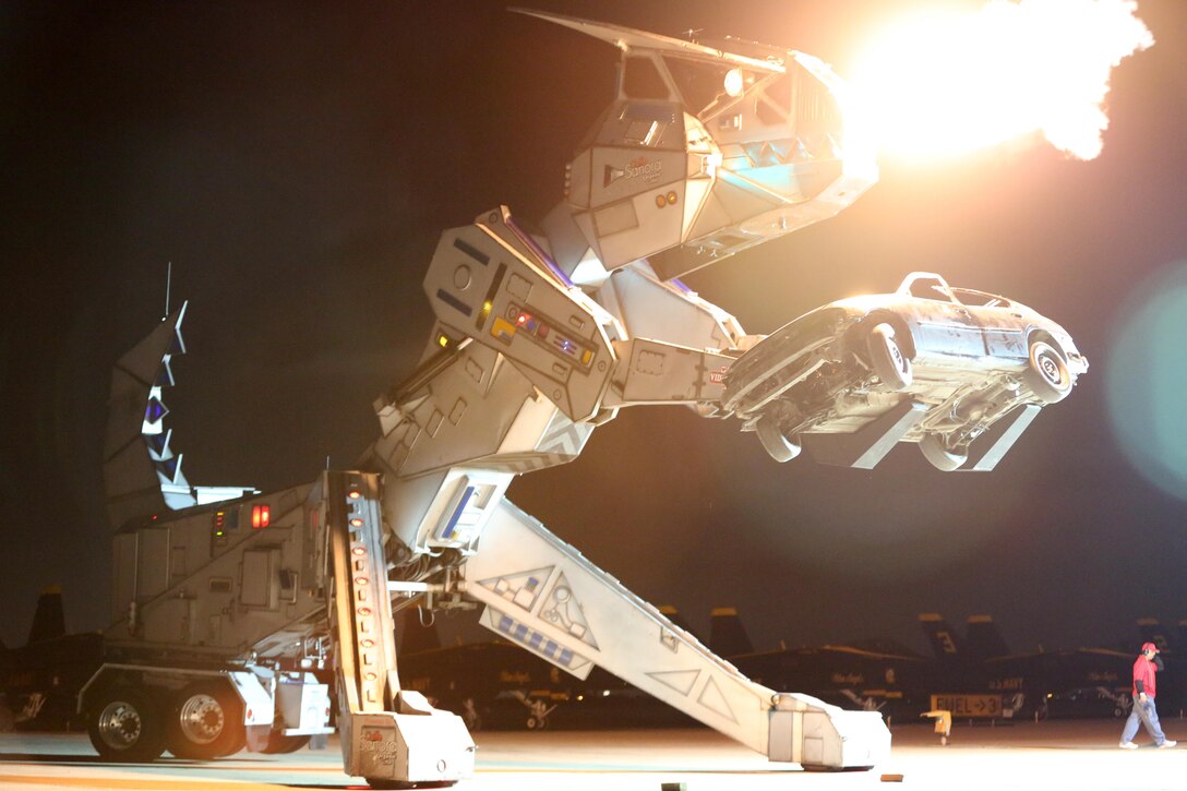 Robosaurus belches fire during its performance at the 2015 MCAS Miramar Air Show aboard Marine Corps Air Station Miramar, California, Oct. 3. Robosaurus transforms from a semi-truck to a 30-ton, 40-foot tall metal T-Rex. (U.S. Marine Corps photo by Sgt. Melissa Wenger/Released)