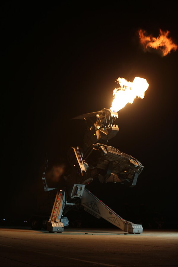 Robosaurus belches fire during its performance at the 2015 MCAS Miramar Air Show aboard Marine Corps Air Station Miramar, California, Oct. 3. Robosaurus transforms from a semi-truck to a 30-ton, 40-foot tall metal T-Rex. (U.S. Marine Corps photo by Sgt. Melissa Wenger/Released)
