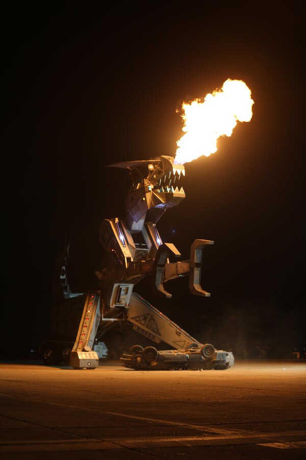 Robosaurus belches fire during its performance at the 2015 MCAS Miramar Air Show aboard Marine Corps Air Station Miramar, California, Oct. 3. Robosaurus transforms from a semi-truck to a 30-ton, 40-foot tall metal T-Rex. (U.S. Marine Corps photo by Sgt. Melissa Wenger/Released)