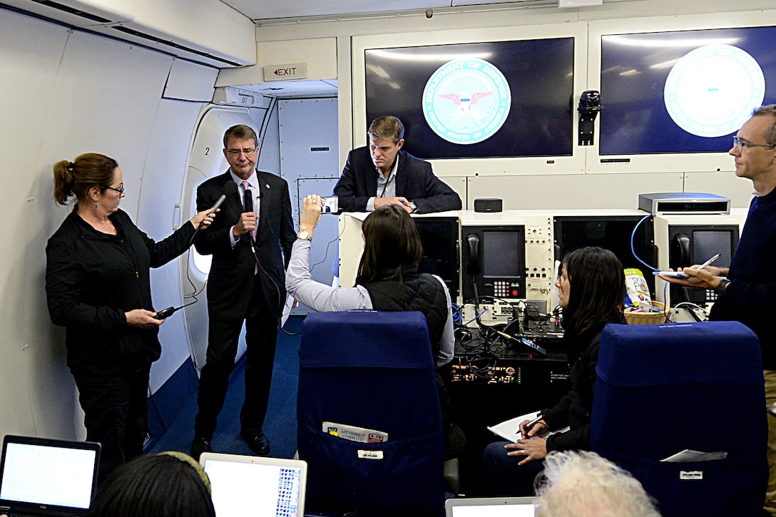 U.S. Defense Secretary Ash Carter briefs reporters while en route to Madrid, Oct. 4, 2015. Carter is on a five-day trip to Spain, Italy, Belgium and the United Kingdom, where he will visit U.S. service members, meet with defense counterparts and attend the NATO Defense Ministerial Conference. DoD photo by U.S. Army Sgt. 1st Class Clydell Kinchen 


