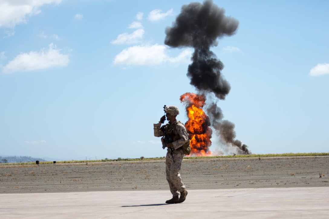 Fire erupts in front of the crowd as part of the Marine Air-Ground Task Force demonstration during the 2015 MCAS Miramar Air Show aboard Marine Corps Air Station Miramar, California, Oct. 2. The MAGTF demonstration showed the capabilities of several air and ground Marine Corps assets. (U.S. Marine Corps photo by Sgt. Michele Hunt/Released)