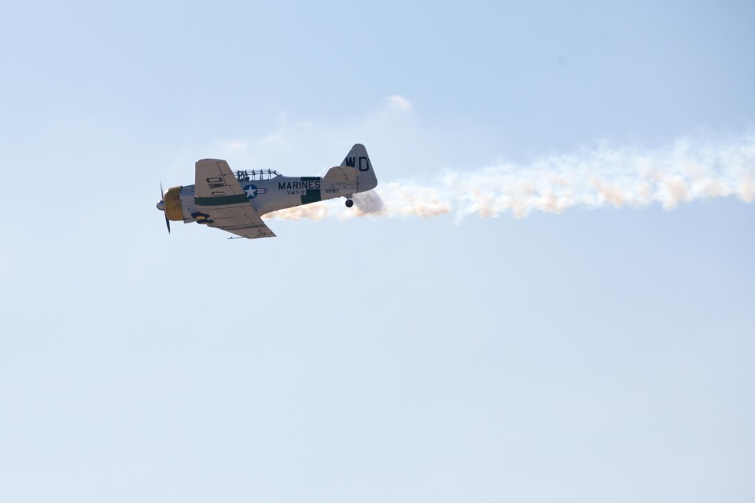 John Collver flies the AT-6 Texan “War Dog” during his performance at the 2015 MCAS Miramar Air Show aboard Marine Corps Air Station Miramar, California, Oct. 3. Collver uses the World War II-era trainer aircraft to demonstrate the aerial maneuvers taught to dogfighting American pilots more than 60 years ago. (U.S. photo by Sgt. Michele Hunt/Released)
