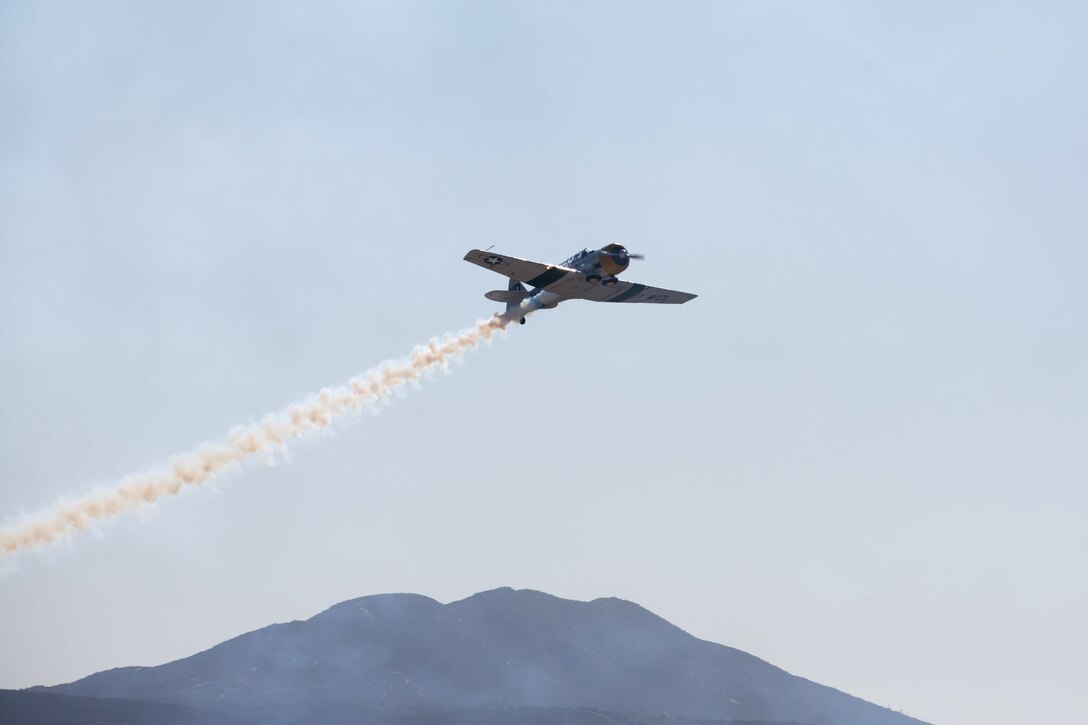 John Collver flies the AT-6 Texan “War Dog” during his performance at the 2015 MCAS Miramar Air Show aboard Marine Corps Air Station Miramar, California, Oct. 3. Collver uses the World War II-era trainer aircraft to demonstrate the aerial maneuvers taught to dogfighting American pilots more than 60 years ago. (U.S. photo by Sgt. Michele Hunt/Released)