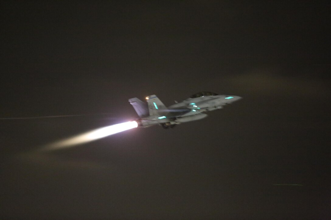 An F/A-18 Hornet illuminates the flight line during the 2015 MCAS Miramar Air Show’s Twilight Show aboard Marine Corps Air Station Miramar, Calif., Oct. 3. The Twilight Show consists of a few of the day’s favorite acts and ends with the "Great Wall of Fire." (U.S. Marine Corps photo by Lance Cpl. Kimberlyn Adams/Released)