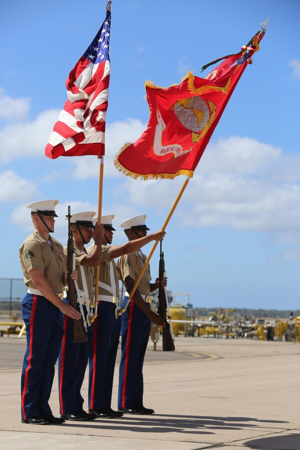 A color guard presents the American flag and Marine Corps emblem during the opening ceremony of the 2015 MCAS Miramar Air Show aboard Marine Corps Air Station Miramar, California, Oct. 2. Demonstrations and static displays followed the kick-off ceremony for the world’s largest military air show. (U.S. Marine Corps photo by Sgt. Michele Hunt/Released)