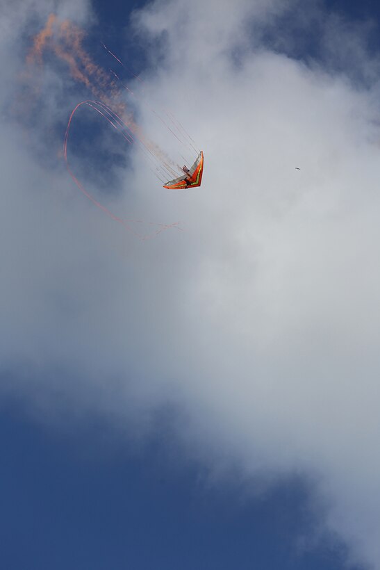 Dan Buchanan’s power glider paints the sky with colored smoke on the flight line 2015 MCAS Air Show aboard Marine Corps Air Station Miramar, California, Oct. 2. Buchanan uses special effects to illuminate and emit colored smoke from his power glider. (U.S. Marine Corps photo by Sgt. Melissa Wenger/Released)