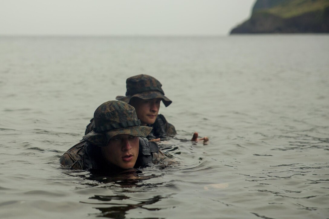 Cpl. Wills Brooks, front, and Lance Cpl. Maksimilian Pavloskiy execute scout swimmer techniques during clandestine landing training at Ternate, Philippines, Oct. 1, 2015. The Marines rehearsed clandestine landings and withdrawals with their Filipino counterparts, which increased their mission readiness during maritime raid operations. This training was in part of Amphibious Landing Exercise 2015, which is an annual, bilateral training exercise conducted by U.S. Marine and Navy Forces with the Armed Forces of the Philippines in order to strengthen our interoperability and working relationships across the range of military operations — from disaster relief, to complex expeditionary operations. Brooks from Nashville, Tenn. is a reconnaissance man with 3rd Reconnaissance Battalion, 3rd Marine Division, III Marine Expeditionary Force. Pavloskiy from Pittsburgh, Pennsylvania, is a reconnaissance man with 3rd Recon Bn, 3rd MarDiv, III MEF. 