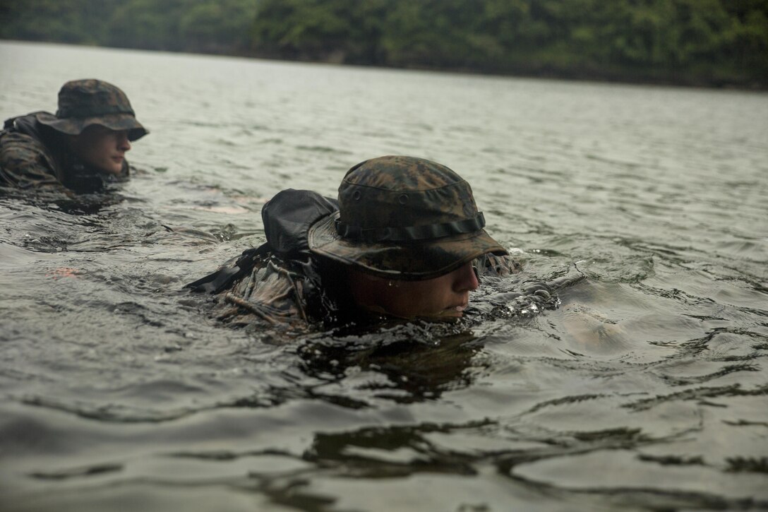 Cpl. Wills Brooks, front, and Lance Cpl. Maksimilian Pavloskiy execute scout swimmer techniques during clandestine landing training at Ternate, Philippines, Oct. 1, 2015. The Marines rehearsed clandestine landings and withdrawals with their Filipino counterparts, which increased their mission readiness during maritime raid operations. This training was in part of Amphibious Landing Exercise 2015, which is an annual, bilateral training exercise conducted by U.S. Marine and Navy Forces with the Armed Forces of the Philippines in order to strengthen our interoperability and working relationships across the range of military operations — from disaster relief, to complex expeditionary operations. Brooks from Nashville, Tenn., is a reconnaissance man with 3rd Reconnaissance Battalion, 3rd Marine Division, III Marine Expeditionary Force. Pavloskiy from Pittsburgh, Penn., is a reconnaissance man with 3rd Recon Bn, 3rd MarDiv, III MEF. 