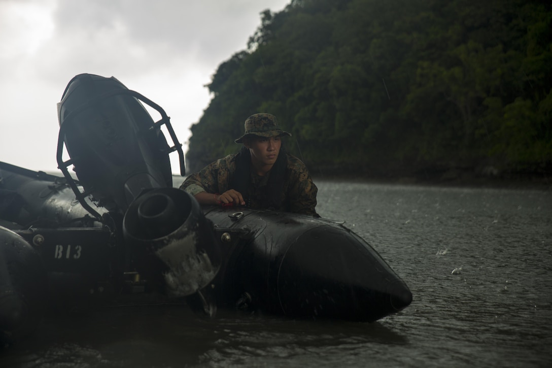 Lance Cpl. Charles Caley guards a combat rubber raiding craft during clandestine operations at Ternate, Philippines, Oct. 1, 2015. The Marines rehearsed clandestine landings and withdrawals with their Filipino counterparts, increasing their mission readiness during maritime raid operations. This training was part of Amphibious Landing Exercise 2015, which is an annual, bilateral training exercise conducted by U.S. Marine and Navy Forces with the Armed Forces of the Philippines to strengthen our interoperability and working relationships across a wide range of military operations, from disaster relief to complex expeditionary operations. Caley, from La Mirada, Calif., is a reconnaissance man with 3rd Reconnaissance Battalion, 3rd Marine Division, III Marine Expeditionary Force.