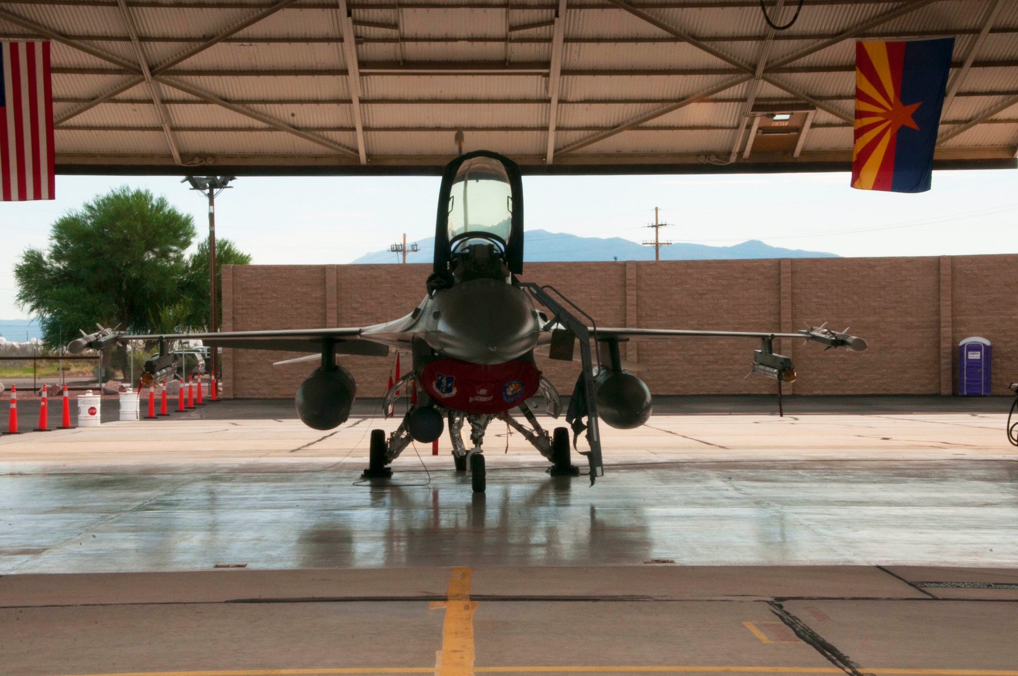 An F-16 from the Aerospace Control Alert Detachment from the 162nd Wing sits at the ready in a hangar at Davis-Monthan Air Force Base in Tucson, Arizona, Sept. 12, 2015. The detachment maintains the ability to quickly scramble in response to airborne threats in the Southwest United States, as well as proactively defend large gatherings and high profile events. (Air National Guard photo by Senior Airman David English)