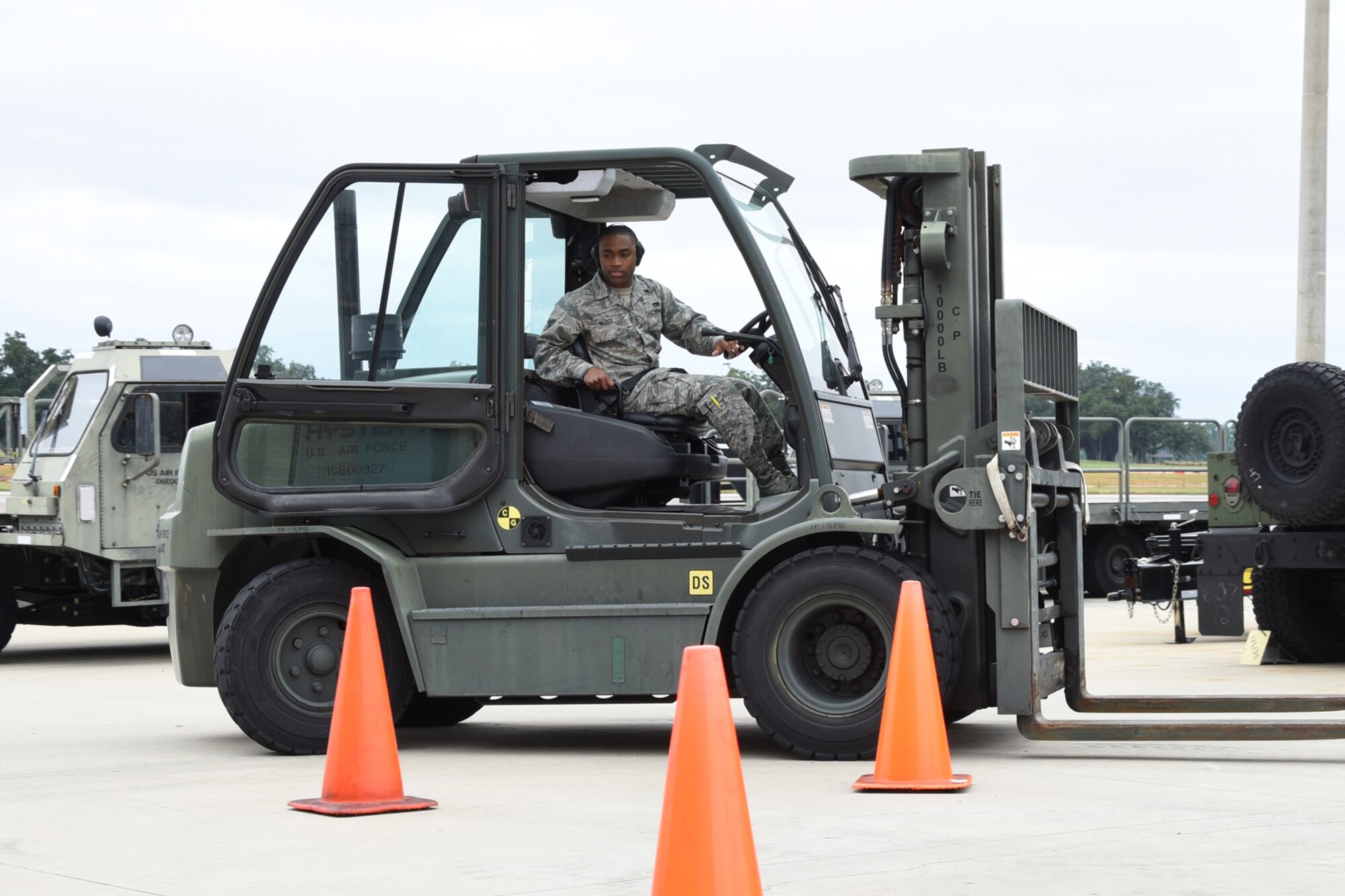 Senior Airman Darius Miller, 403rd Aerial Port Squadron aircraft transportation journeyman, weaves forklift between construction cones during the forklift competition of the “Port Dawg” Challenge Oct. 3, 2015, at Keesler Air Force Base, Mississippi. The competition is designed to develop healthy competitiveness and esprit de corps while working on building a more proficient aerial port squadron. (U.S. Air Force photo/Tech. Sgt. Ryan Labadens)