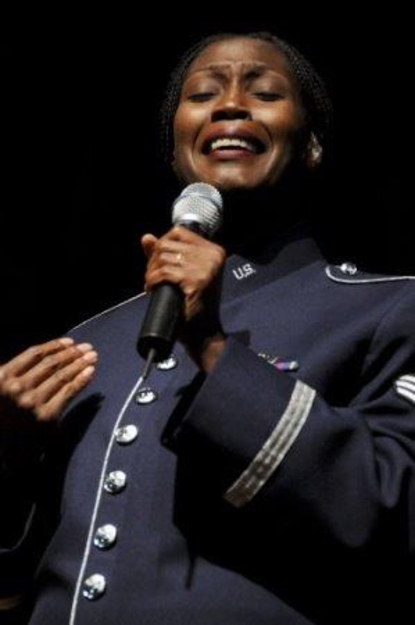 Staff Sgt. Lisa Cimino, a chaplain’s assistant and professional vocalist, performs at a 555th Air National Guard Band event in 2010. Sergeant Cimino is a chaplain’s assistant with the 161st Air Refueling Wing and she connects with others through singing and encouraging words. (Courtesy photo)