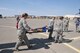 Airmen from the 341st and 120th Medical Groups transport a simulated casualty victim on a litter during a mass casualty exercise Aug. 10, 2015, at Malmstrom Air Force Base, Mont. The exercise tested the units’ abilities to jointly respond to a mass casualty event resulting from a natural disaster.(U.S. Air National Guard photo/ Tech. Sgt. Michael Touchette)