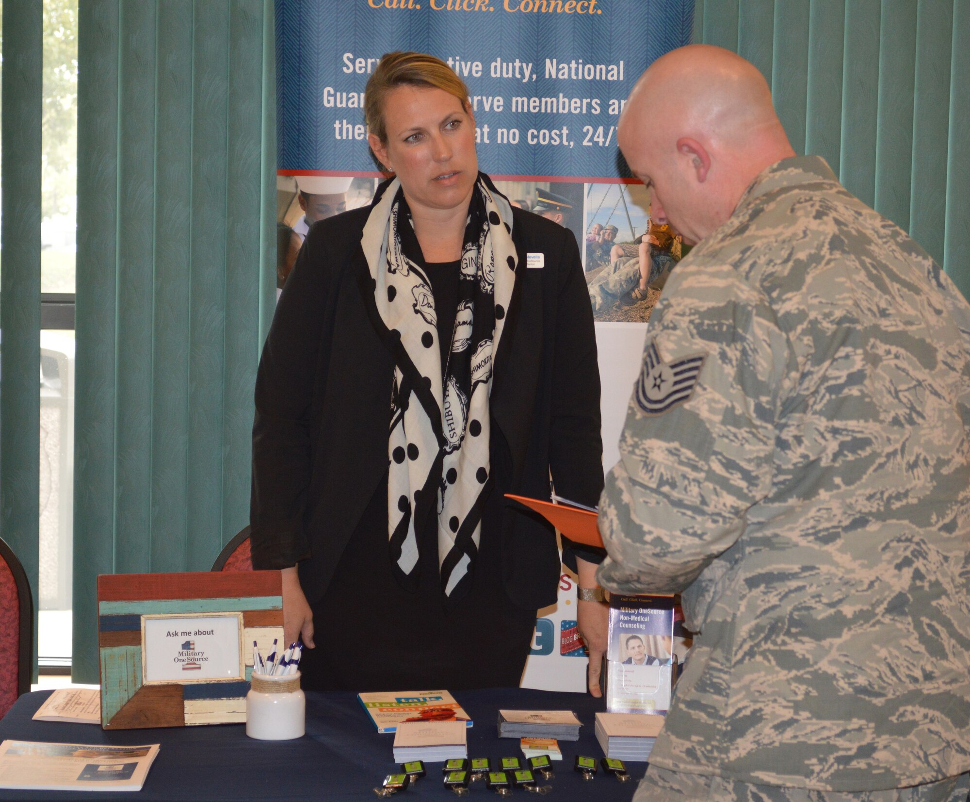 Amy Nevells, New York Military One Source Consultant, talks with an Airman with the 109th Airlift Wing who will be deploying in support of Operation Deep Freeze, about services availalbe to him and his family during the first-ever White Ribbon event at Stratton Air National Guard Base, New York, on Oct. 3, 2015. The White Ribbon is very similar to the Yellow Ribbon events offered to those affected by contingency deployments. The White Ribbon is unique to the 109th AW because of their annual deployments to McMurdo Station, Antarctica. (U.S. Air National Guard photo by Tech. Sgt. Catharine Schmidt/Released)