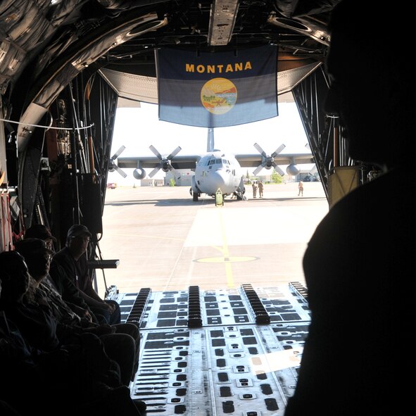 A loadmaster from the 120th Airlift Wing gives a safety brief to civilian bosses of Montana Air National Guard and Reserve members during a boss-lift on a C-130 Hercules June 6, 2015, in Great Falls, Mont. Boss-lift events are set up by the Employer Support of the Guard and Reserve to educate civilian bosses of Guard members’ duties. (U.S. Air National Guard photo/Staff Sgt Lindsey Soulsby)