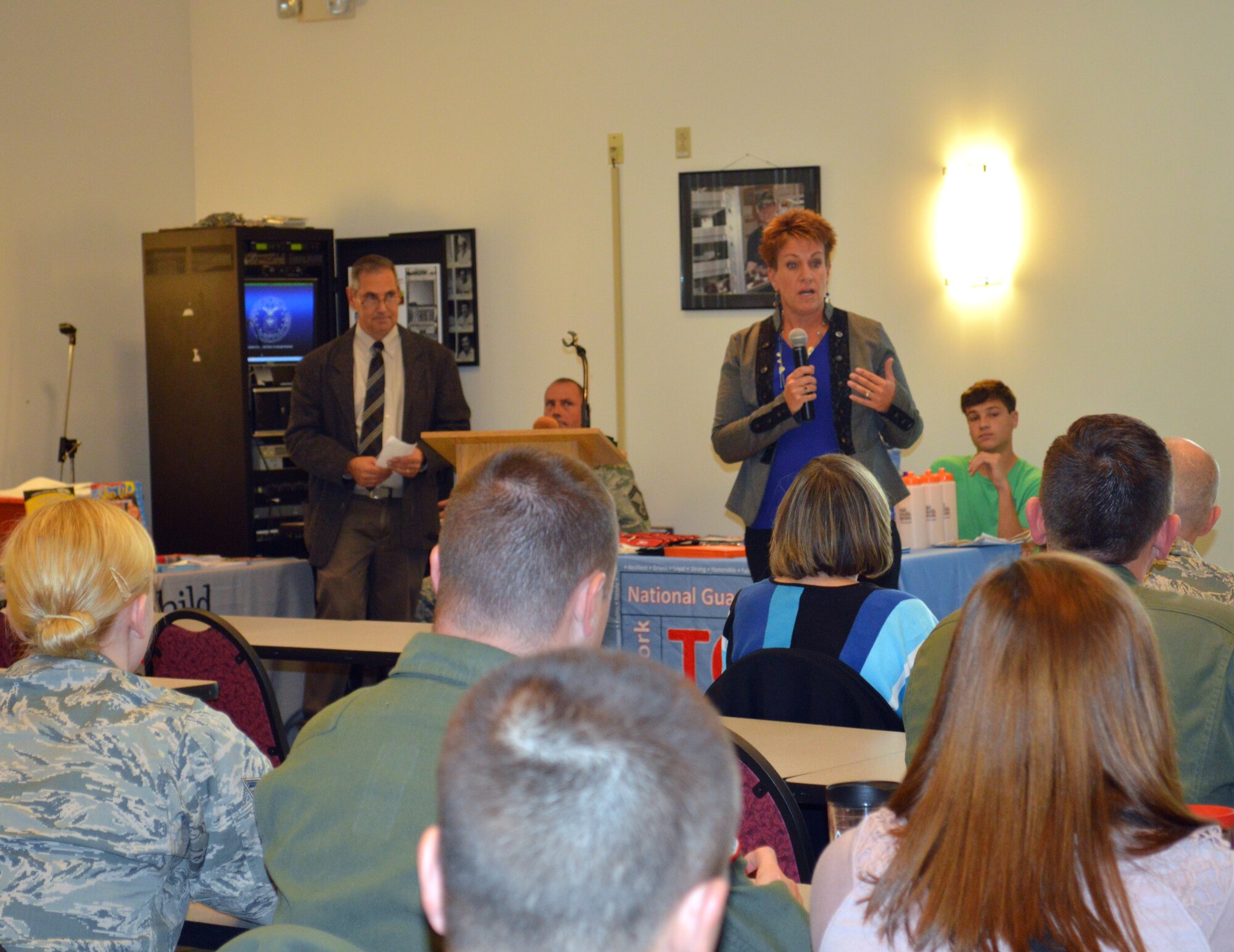 Colleen Casey, 109th Airman and Family Readiness Program manager, speaks to Airmen and family members during the first-ever White Ribbon event at Stratton Air National Guard Base, New York, on Oct. 3, 2015. The White Ribbon is very similar to the Yellow Ribbon events offered to those affected by contingency deployments. The White Ribbon is unique to the 109th AW because of their annual deployments to McMurdo Station, Antarctica. (U.S. Air National Guard photo by Tech. Sgt. Catharine Schmidt/Released)