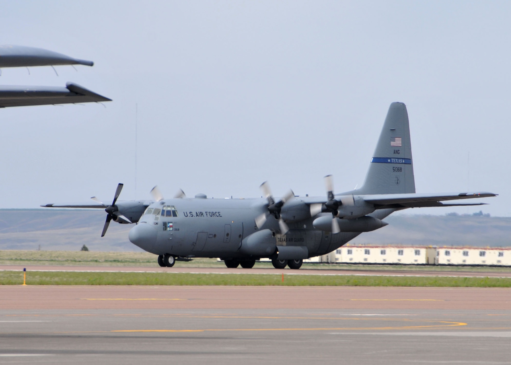 A C-130 Hercules transport aircraft assigned to the Texas Air National Guard lands at the Great Falls International Airport April 29, 2015, after experiencing an in-flight emergency. Members of the 120th Maintenance Group repaired the aircraft so it could continue on with its mission. (U.S. Air National Guard photo/Senior Master Sgt. Eric Peterson)

