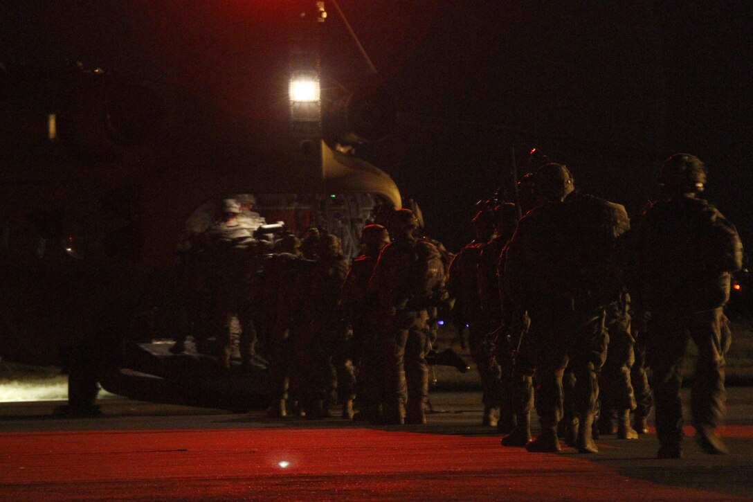 Paratroopers board a CH-47 Chinook helicopter to conduct an air assault training mission at the Joint Readiness Training Center, Alexandria, La., Oct. 2, 2015. The paratroopers were transported to a training area on Fort Polk, La. U.S. Army photo by Sgt. 1st Class Mary Rose Mittlesteadt