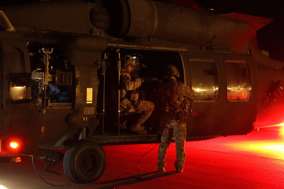 Paratroopers load up into a UH-60 Black Hawk helicopter as they prepare to be dropped into a training area on Fort Polk, La., to conduct an air assault training mission at the Joint Readiness Training Center in Alexandria, La., Oct. 2, 2015. U.S. Army photo by Sgt. 1st Class Mary Rose Mittlesteadt