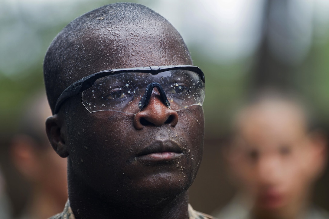Army Pvt. Amas Kone, in his second week of basic combat training, waits patiently for the winner of the super squad challenge to be announced at the Fit to Win endurance course on Fort Jackson, S.C., Oct. 1, 2015. Kone is assigned to Company B, 3rd Battalion, 34th Infantry Regiment. U.S. Army photo by Sgt. 1st Class Brian Hamilton
