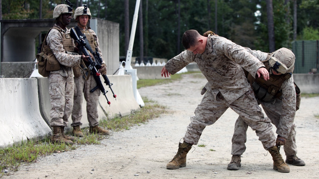 Lance Cpl. Tyler, Shiels, right, conducts a search of Cpl. Kyle Lamprich during a security forces training exercise at Marine Corps Base Camp Lejeune, North Carolina, Sept. 30, 2015. More than 30 Marines with 2nd Low Altitude Air Defense Battalion participated in the week-long training, covering a full spectrum of scenarios they may encounter while deployed. Shiels and Lamprich are both low altitude air defense gunners with the squadron. 