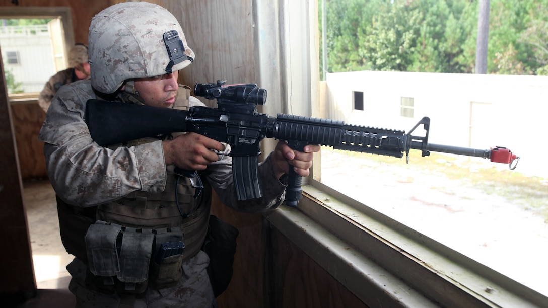 Lance Cpl. Jonathan Velasco engages a target as he provided security during a security forces training exercise at Marine Corps Base Camp Lejeune, North Carolina, Sept. 30, 2015. More than 30 Marines with 2nd Low Altitude Air Defense Battalion participated in the week-long training, covering a full spectrum of scenarios they may encounter while deployed. Velasco is a low altitude air defense gunner with the battalion. 