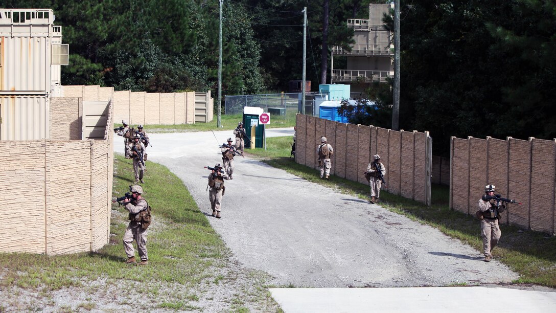 Marines patrol during a security forces training exercise at Marine Corps Base Camp Lejeune, North Carolina, Sept. 30, 2015. More than 30 Marines with 2nd Low Altitude Air Defense Battalion participated in the week-long training, covering a full spectrum of scenarios they may encounter while deployed. The Marines are all low altitude air defense gunners with the battalion. 