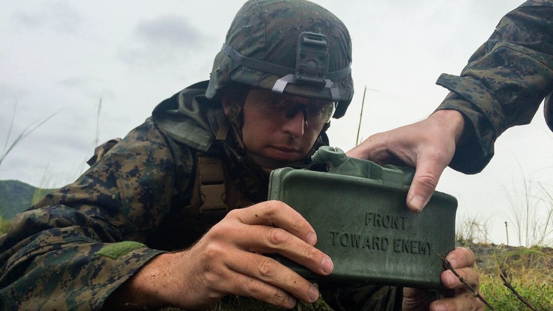 U.S. Marine Lance Cpl. Mitchell Kokoruda places a claymore mine during demolition training at Crow Valley, Philippines, Oct. 2, 2015. The Philippine Marines and the U.S. Marines with Echo Company, Battalion Landing Team 2nd Battalion, 5th Marines, 31st Marine Expeditionary Unit, conducted the side-by-side training as part of Amphibious Landing Exercise 2015, a bilateral training exercise conducted by members of the Armed Forces of the Philippines alongside U.S. Marine and Navy forces. PHIBLEX focuses on strengthening the relationship between the two nations across a range of military operations, including disaster relief and complex expeditionary operations. 