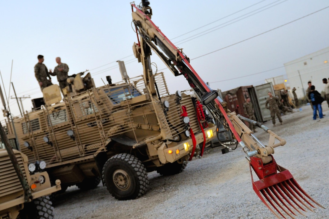U.S. soldiers prepare their vehicles, equipment, and weapons systems before a route clearance mission on Bagram Airfield, Afghanistan, Sept. 18, 2015. U.S. Army Photo by Sgt. 1st Class David Wheeler
