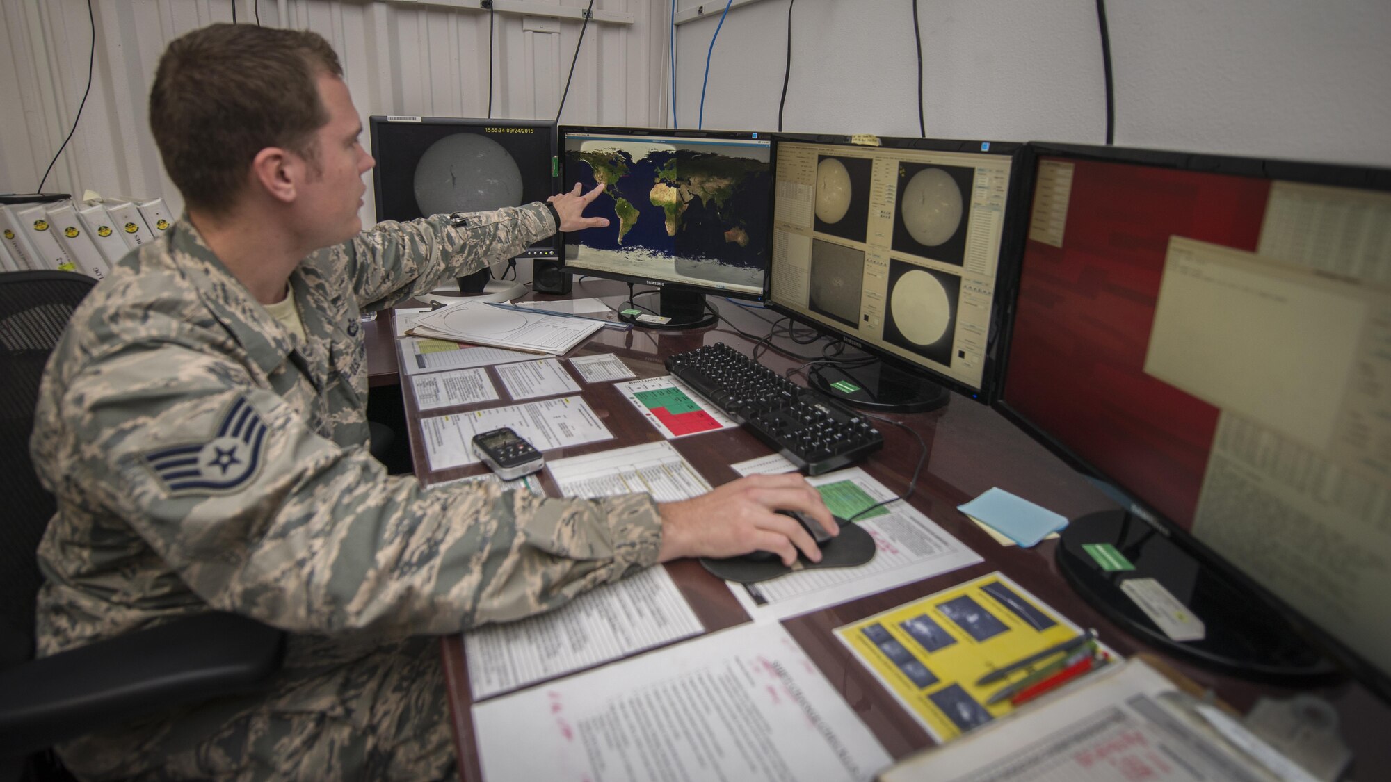 Staff Sgt. Erin O’Connell, a solar analyst with Detachment 2, 2nd Weather Squadron, monitors multiple live readings from the sun at the Holloman Solar Observatory on Holloman Air Force Base, N.M., Sept. 24, 2015. O’Connell was looking for any kind of solar activity that might affect Earth. The solar observatory works jointly with civilian and Defense Department customers who utilize the information in different ways. (U.S. Air Force photo/Senior Airman Aaron Montoya)