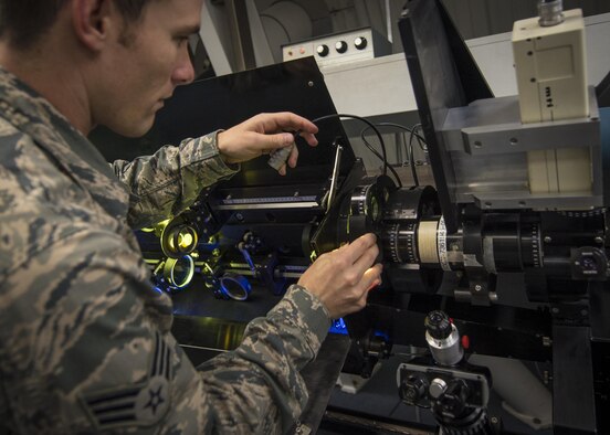 Senior Airman Samuel Davis, an airfield systems maintenance apprentice with the Detachment 2, 2nd Weather Squadron, reinstalls a solar telescope’s polaroid servo after repairing it at the Holloman Solar Observatory on Holloman Air Force Base, N.M., on Sept. 24, 2015. The observatory monitors solar activity and reports their findings to various agencies that disperse gathered information in order to facilitate protective and safeguard measures as well as research and forecasting initiatives. (U.S. Air Force photo/Senior Airman Aaron Montoya)