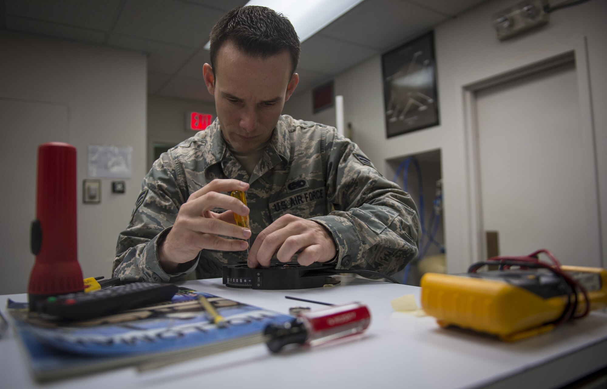 Senior Airman Samuel Davis, an airfield systems maintenance apprentice with Detachment 2, 2nd Weather Squadron, repairs the solar telescope’s polaroid servo for the automatic gain control at the Holloman Solar Observatory on Holloman Air Force Base, N.M., Sept. 24, 2015. Davis is a depot-level maintenance technician who makes repairs on the three solar observatory telescopes around the world, the other two being in Learmonth, Australia and San Vito, Italy. (U.S. Air Force photo/Senior Airman Aaron Montoya)