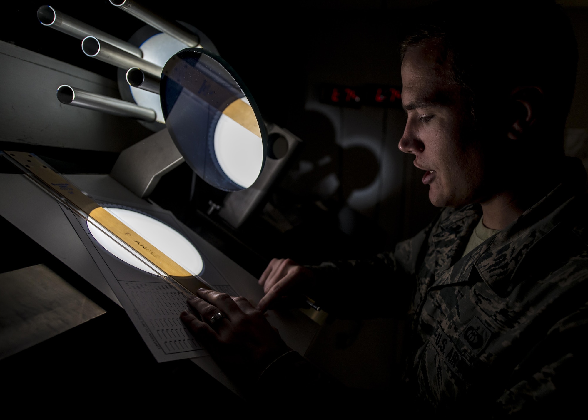 Staff Sgt. Erin O’Connell, a solar analyst with Detachment 2, 2nd Weather Squadron, creates a sunspot drawing from a projected image of the sun at the Holloman Solar Observatory on Holloman Air Force Base, N.M., Sept. 24, 2015. Sunspots are temporary phenomena on the visible surface of the sun that appear visibly as dark spots compared to surrounding regions. The solar analysts closely monitor this information in order to safeguard and protect important assets in both civilian and Defense Department agencies. (U.S. Air Force photo/Senior Airman Aaron Montoya)