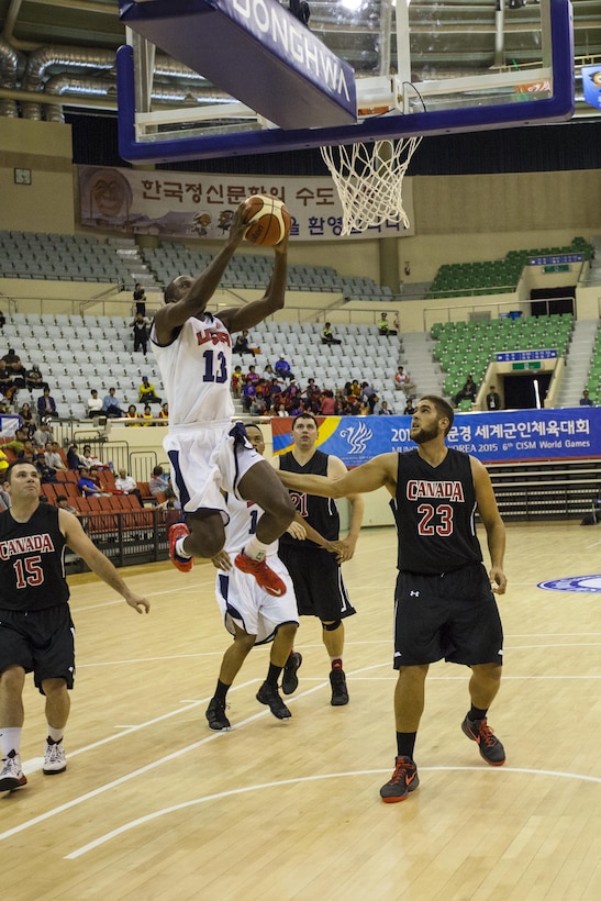 Number 13 Army 1st Lt. Ella Ellis and the U.S. Men's Basketball team vs. Canada Men’s Basketball team. The CISM World Games provides the opportunity for the athletes of over 100 different nations to come together and enjoy friendship through sports. The sixth annual CISM World Games are being held aboard Mungyeong, South Korea, Sept. 30 - Oct. 11.