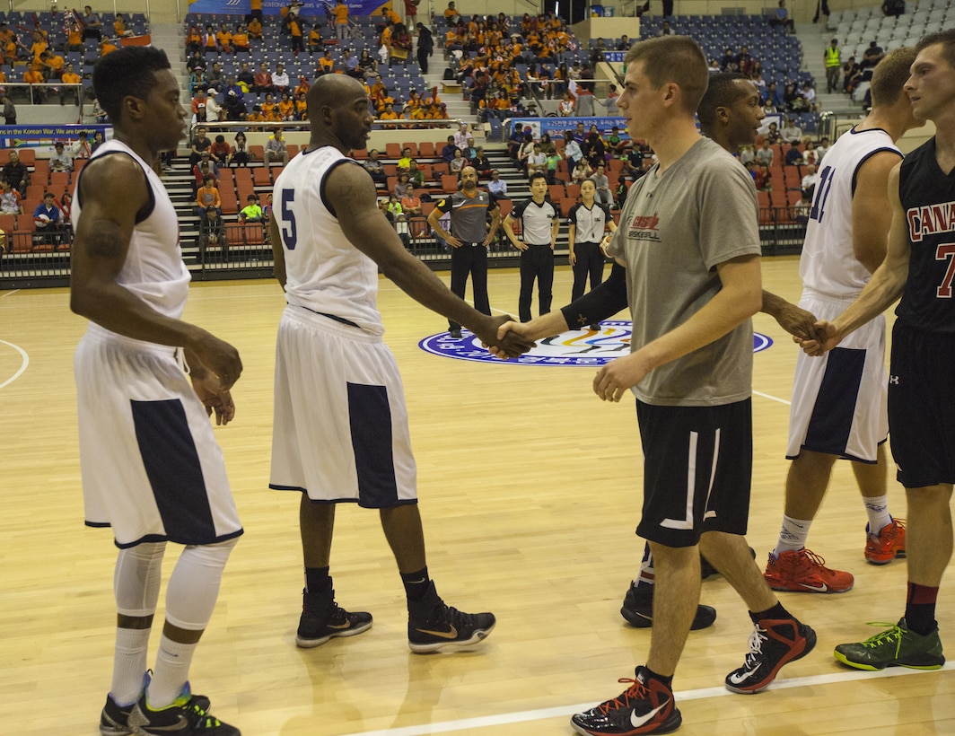 U.S. Men's Basketball Team shakes hands with Canadian Men’s Basketball team after winning the first game. The CISM World Games provides the opportunity for the athletes of over 100 different nations to come together and enjoy friendship through sports. The sixth annual CISM World Games are being held aboard Mungyeong, South Korea, Sept. 30 - Oct. 11.