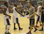 U.S. Men's Basketball Team shakes hands with Canadian Men’s Basketball team after winning the first game. The CISM World Games provides the opportunity for the athletes of over 100 different nations to come together and enjoy friendship through sports. The sixth annual CISM World Games are being held aboard Mungyeong, South Korea, Sept. 30 - Oct. 11.