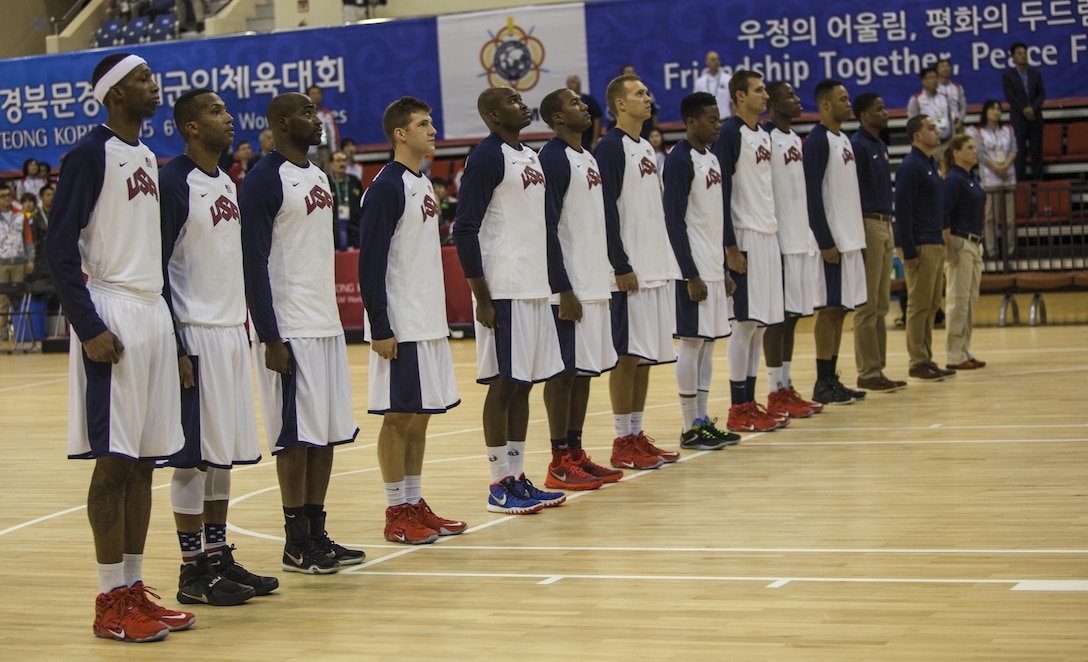 The U.S. Men's Basketball Team stands at attention for the national anthem during the U.S. Vs. Canada Men’s Basketball game. The CISM World Games provides the opportunity for the athletes of over 100 different nations to come together and enjoy friendship through sports. The sixth annual CISM World Games are being held aboard Mungyeong, South Korea, Sept. 30 - Oct. 11.