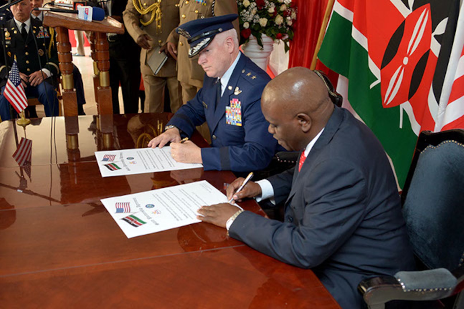 – Maj. Gen. L. Scott Rice, the adjutant general, Massachusetts National Guard, and Mr. Kiritu Miano Wamae, acting principal secretary, Kenya Ministry of Defence, sign the state partnership agreement between the Republic of Kenya and the Massachusetts National Guard during a ceremony held at the Ministry of Defence, in Nairobi on Oct. 1, 2015.