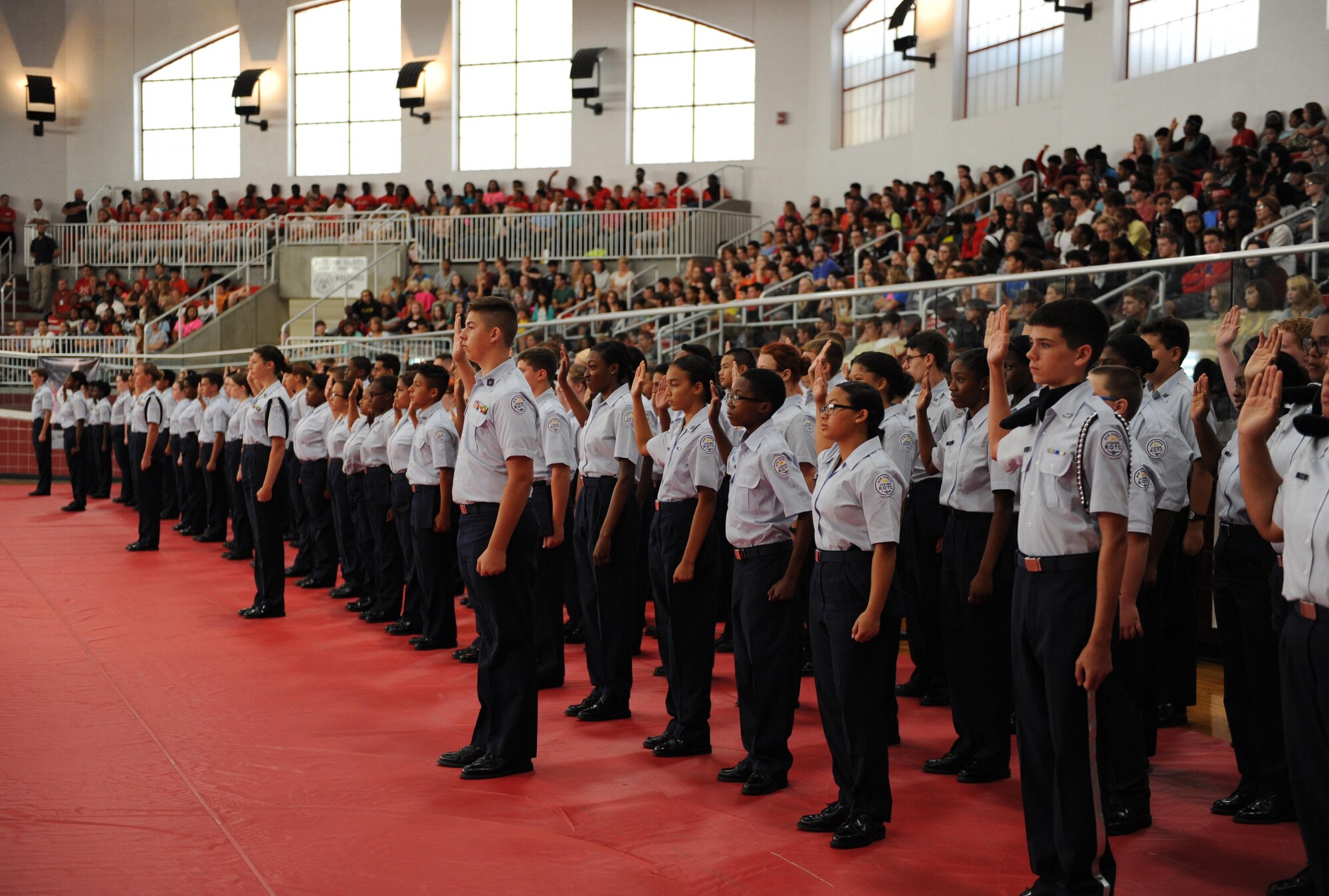 More than 100 Biloxi High School Junior ROTC cadets recite the cadet oath during a ceremony at Biloxi High School, Sept. 30, 2015, Biloxi, Miss. Col. Scott Solomon, 81st Training Group commander, delivered the oath. (U.S. Air Force photo by Kemberly Groue)