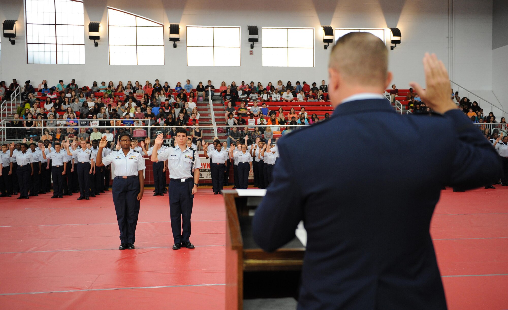 Col. Scott Solomon, 81st Training Group commander, administers the cadet oath during the Biloxi High School Cadet Oath ceremony at Biloxi High School, Sept. 30, 2015,Biloxi Miss. Solomon delivered the oath to more than 100 Junior ROTC cadets. (U.S. Air Force photo by Kemberly Groue)