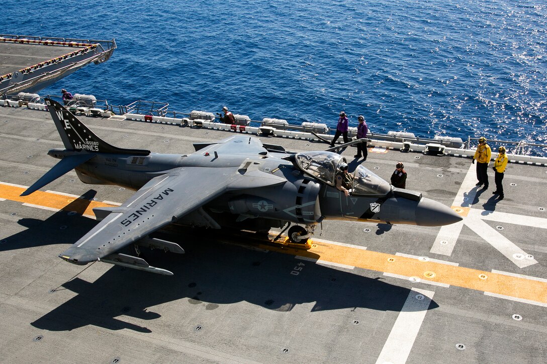 U.S. Marines and sailors prepare an AV-8B Harrier for takeoff during flight operations on the flight deck of the USS Boxer during Integration Training in the Pacific Ocean, Sept. 25, 2015.  The Marines are assigned to Medium Tiltrotor Squadron 166 Reinforced, 13th Marine Expeditionary Unit. The exercise is the first at sea for the newly integrated 13th MEU to prepare all aspects into their forward deployed roles including the air combat element. U.S. Marine Corps photo by Cpl. Briauna Birl 