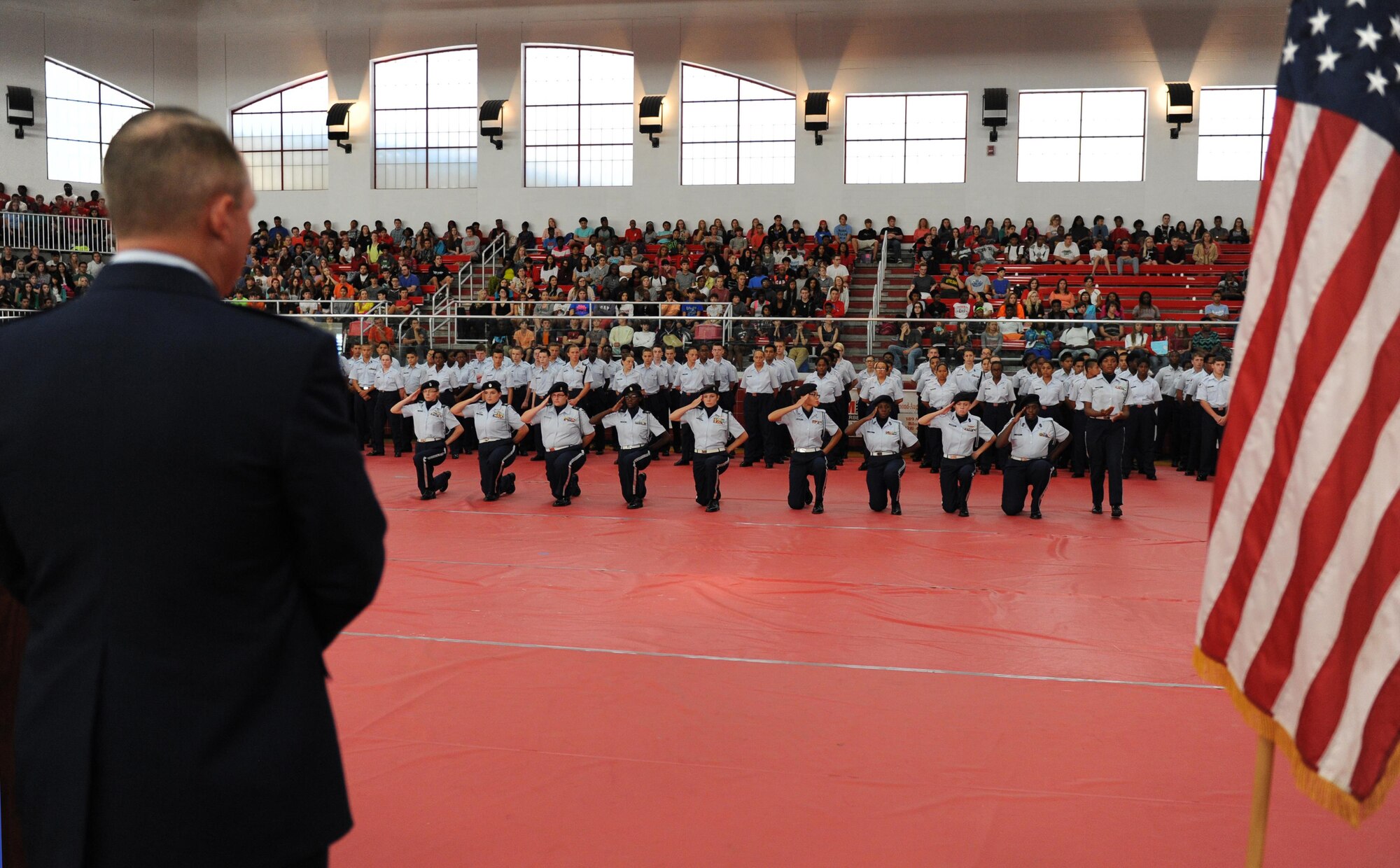 Col. Scott Solomon, 81st Training Group commander, watches the Unarmed Exhibition Drill Team perform their routine during the Biloxi High School Cadet Oath ceremony at Biloxi High School, Sept. 30, 2015,Biloxi, Miss. Solomon also delivered the oath to more than 100 Junior ROTC cadets.  (U.S. Air Force photo by Kemberly Groue)